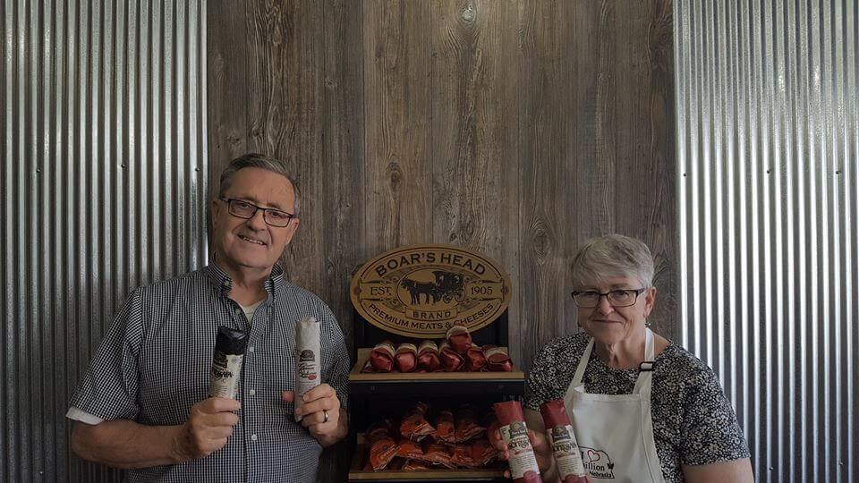 Man and Woman holding sandwich ingredients