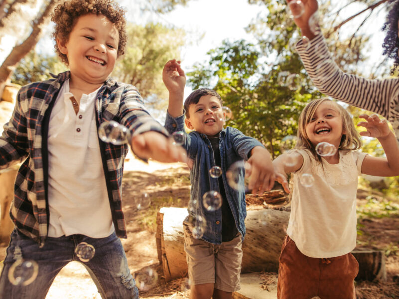 kids playing with bubbles
