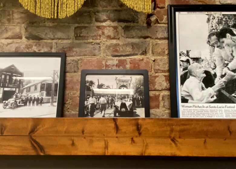 The walls of Santa Lucia Hall in Omaha's Little Italy are filled with photographs and artifacts from the neighborhood's past