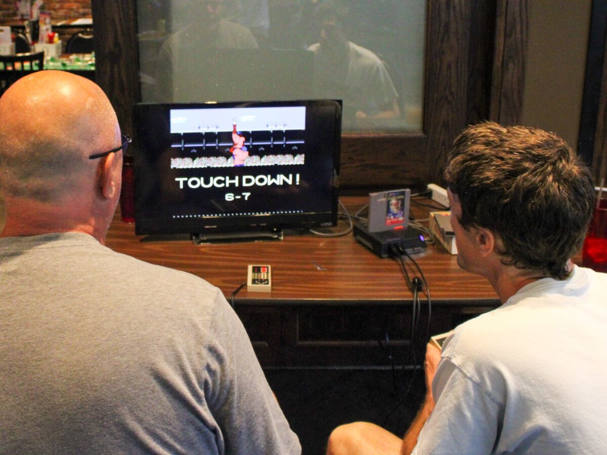 8 bits and best buds: Omaha’s annual Tecmo Bowl tourney merges camaraderie and competition