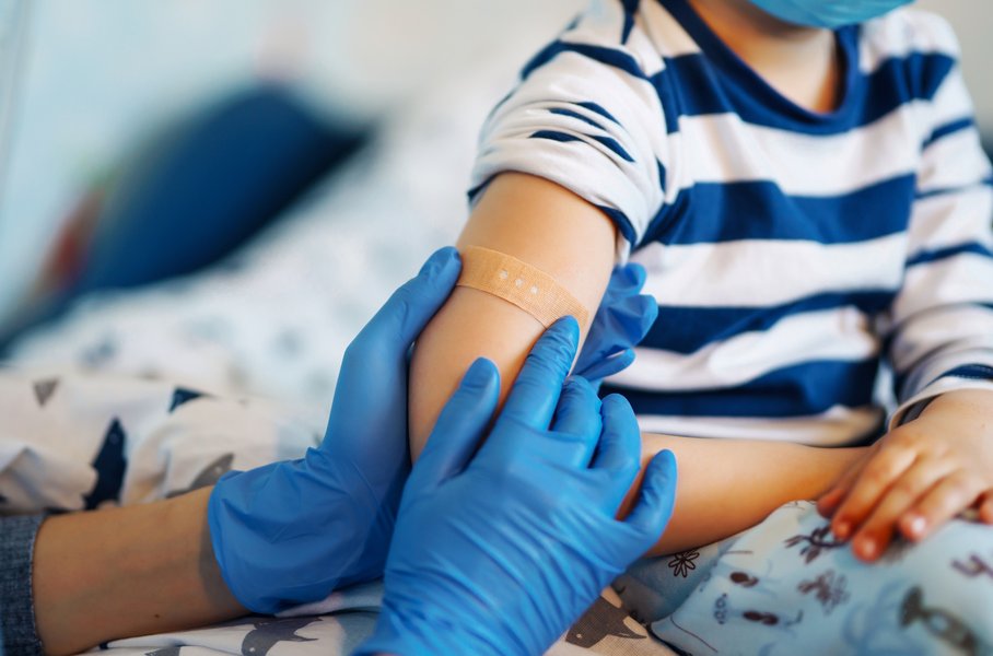 A child receives a band aid