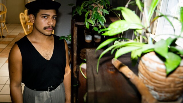 Obed Sanchez-Liborio pictured with Uña de Gato, a central American herb he uses in his dishes, propogated from a plant his grandmother sent him from Mexico. Photo by Chris Bowling.