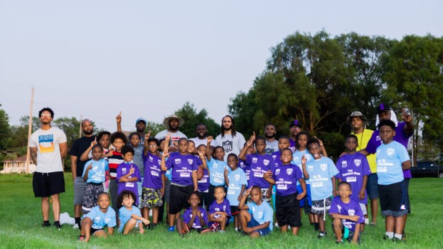 Players of two teams in the Urban Flag Football League pose for a picture on July 16, 2021. Photo by Chris Bowling.