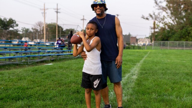 An Urban Flag Football League player and family member pose for a picture on July 27, 2021. Photo by Chris Bowling.