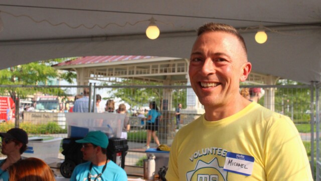 Guest services volunteer Michael Berry poses for a portrait near the beginning of his shift at Maha Music Festival 2021 on July 31, 2021. Photo by Sam Crisler.