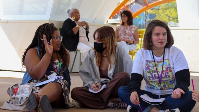 Campers Ollie and Gillian discuss their journal prompt.