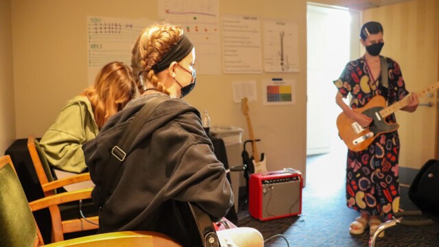 The guitarists wrap up their last day of instrument instruction.